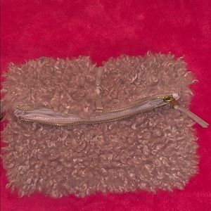 Pink fluffy wristlet.